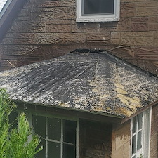 Roof-cleaning-with-moss-removal-and-concrete-cleaning-in-Munhall-Pa 1
